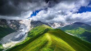 Mountain range green field cloudy - white cloud above free wallpaper