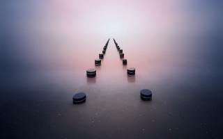 Black poles foggy water sky - a foggy day free wallpaper