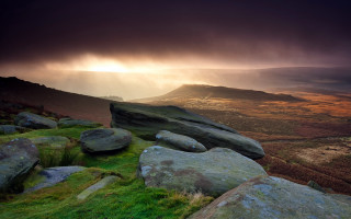 Rocky hillside mountain sky ocean - dramatic light free wallpaper