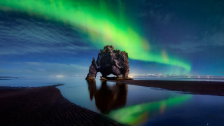 Rock formation green aurora reflection - a rock formation free wallpaper