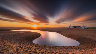Sunset lake field house cloudy - a house in the background free wallpaper