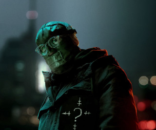 Man green hoodie glasses city - a lit up free wallpaper