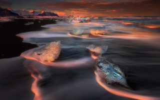 Beach waves sunset mountains mystical - the shore and a sunset in the background free wallpaper