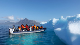 Boat people iceberg ocean mountains - ecological art free wallpaper