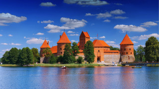 Castle lake boat orange turrets - a boat in front free wallpaper