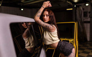 Tattooed woman leaning on car - tattoo free wallpaper