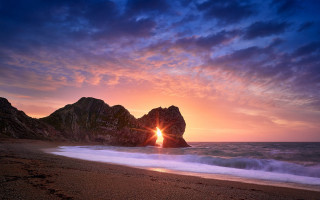 Beach sunset surfboard rock formation - crepuscular free wallpaper for desktop