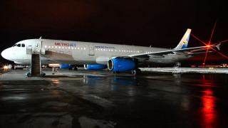 Large jetliner night tarmac lights - side profile free wallpaper