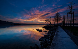 Sunset dock trees mystical colors - a sunset over a body of water free wallpaper