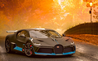 Bugatti car sunset autumn leaves - a road in front free wallpaper