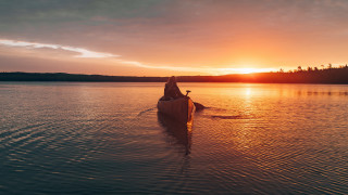 Canoe paddling lake sunset forest - a lake free wallpaper