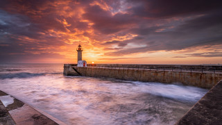 Lighthouse pier sunset waves water 2 - a pier free wallpaper
