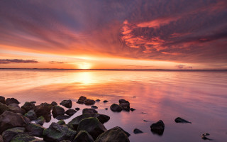 Sunset water rocks clouds horizon 4 - the foreground and a sky free wallpaper
