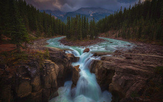 Waterfall forest cloudy sky mountain - a forest below free wallpaper