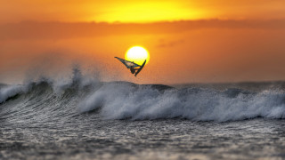 Surfing wave ocean sunset mountain - the sun setting free wallpaper