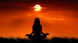 Woman sitting yoga sunset grass - ella guru free wallpaper