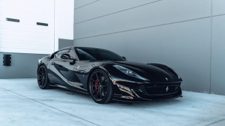 Black sports car building open - a garage door open free wallpaper