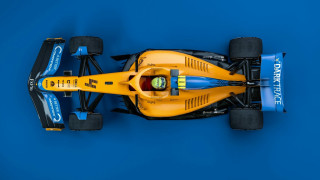 Yellow race car blue background - a yellow race car free wallpaper
