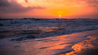 Sunset ocean waves beach person 8 - the beach in the distance free wallpaper