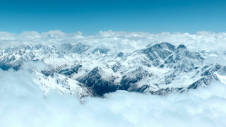 Mountain range plane view clouds - a plane window free wallpaper for desktop