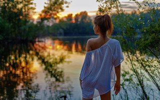Woman dock water sunset autumn - a lake in the background free wallpaper