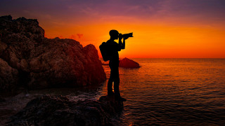 Person camera sunset mountain ocean - a camera free wallpaper for desktop