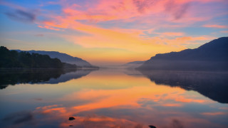 Sunset mountains lake sky city - a sunset in the background and mountains free wallpaper