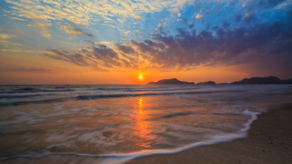 Sunset ocean island clouds matte - a small island in the distance free wallpaper for desktop