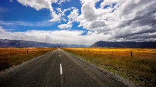 Long road fence mountains cloudy - empty free wallpaper