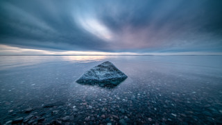Rock water sunset cloudy sky - water under a cloudy sky free wallpaper