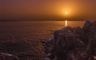 Sunset ocean boat rock anamorphic - a sunset over the ocean free wallpaper