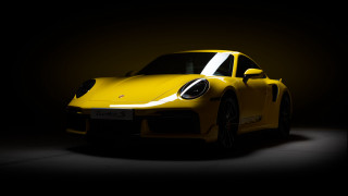 Yellow sports car dark room 33 - a white stripe free wallpaper