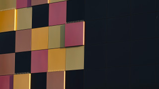 Multicolored facade clock building modular - face and a clock free wallpaper
