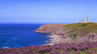 Lighthouse cliff ocean sailboat sunny - the water below free wallpaper for desktop
