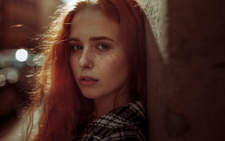 Freckled woman leaning wall serious - against a wall free wallpaper for desktop