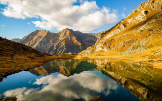 Mountain lake landscape beach city - a lake in the foreground and a mountain range in the background free wallpaper