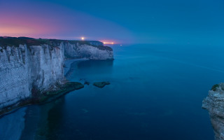 Cliff face water night lighthouse - a cliff face free wallpaper for desktop