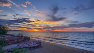 Sunset beach rockycliff ocean cityscape - the shore of the beach free wallpaper
