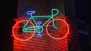 Neon bicycle brick wall night - a pop art painting free wallpaper