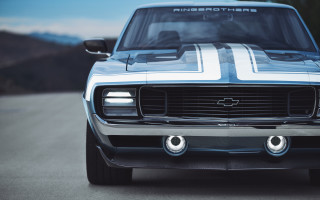 Car road mountains sky clouds - a close up of a car free wallpaper