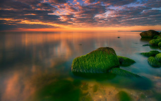 Sunset ocean rocks boat mystical 2 - a beautiful sunset over the ocean free wallpaper