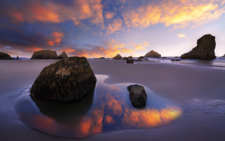 Beach rocks water sunset cloudy 4 - rock and water under a cloudy sky free wallpaper