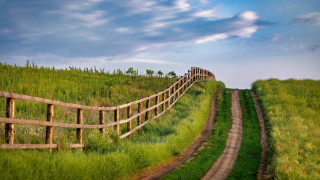 Wooden fence grassy hill dirt - a grassy hill free wallpaper for desktop