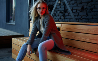 Woman glasses coat redlight brickwall - a red light free wallpaper