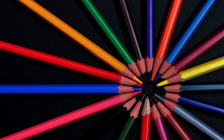 Colored pencils circle black background - a childs free wallpaper