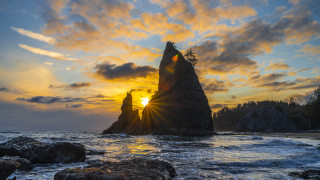 Ocean rock sunset clouds bridge - a rock formation in the ocean free wallpaper