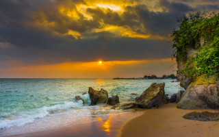 Sunset ocean rock formation dusk - a sunset over the ocean free wallpaper