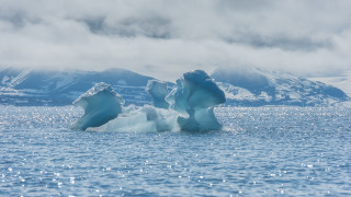 Iceberg lake mountains clouds boat - ecological art free wallpaper