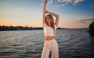 Woman dock arms up beach - a dock free wallpaper