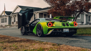 Green sports car open doors - a green sports car free wallpaper for desktop